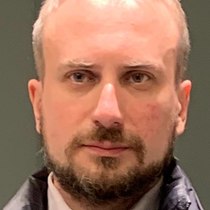 Роман Олин